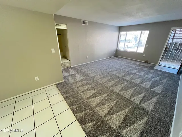 a view of an empty room and window