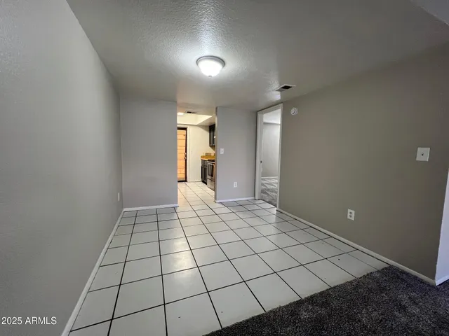 a view of an empty room and window