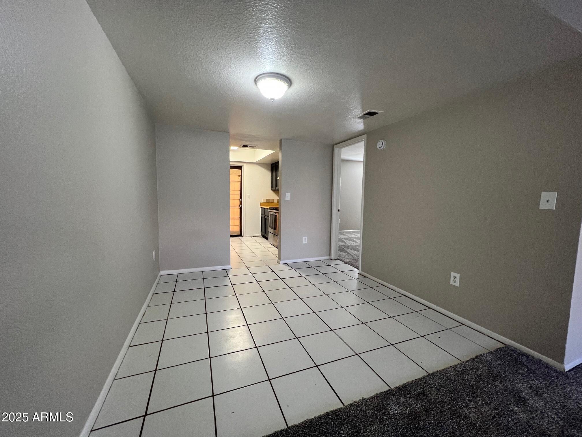 1927 East Hampton Avenue, Unit 136 Mesa, AZ 85204 - Photo 7 of 26 a view of an empty room and window
