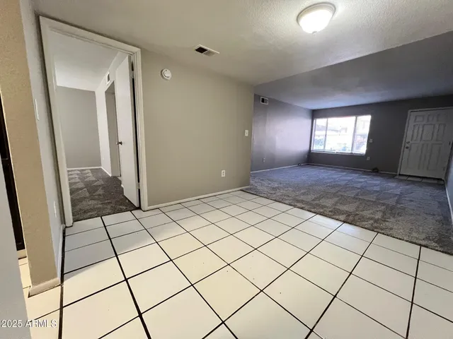 a view of an empty room and window