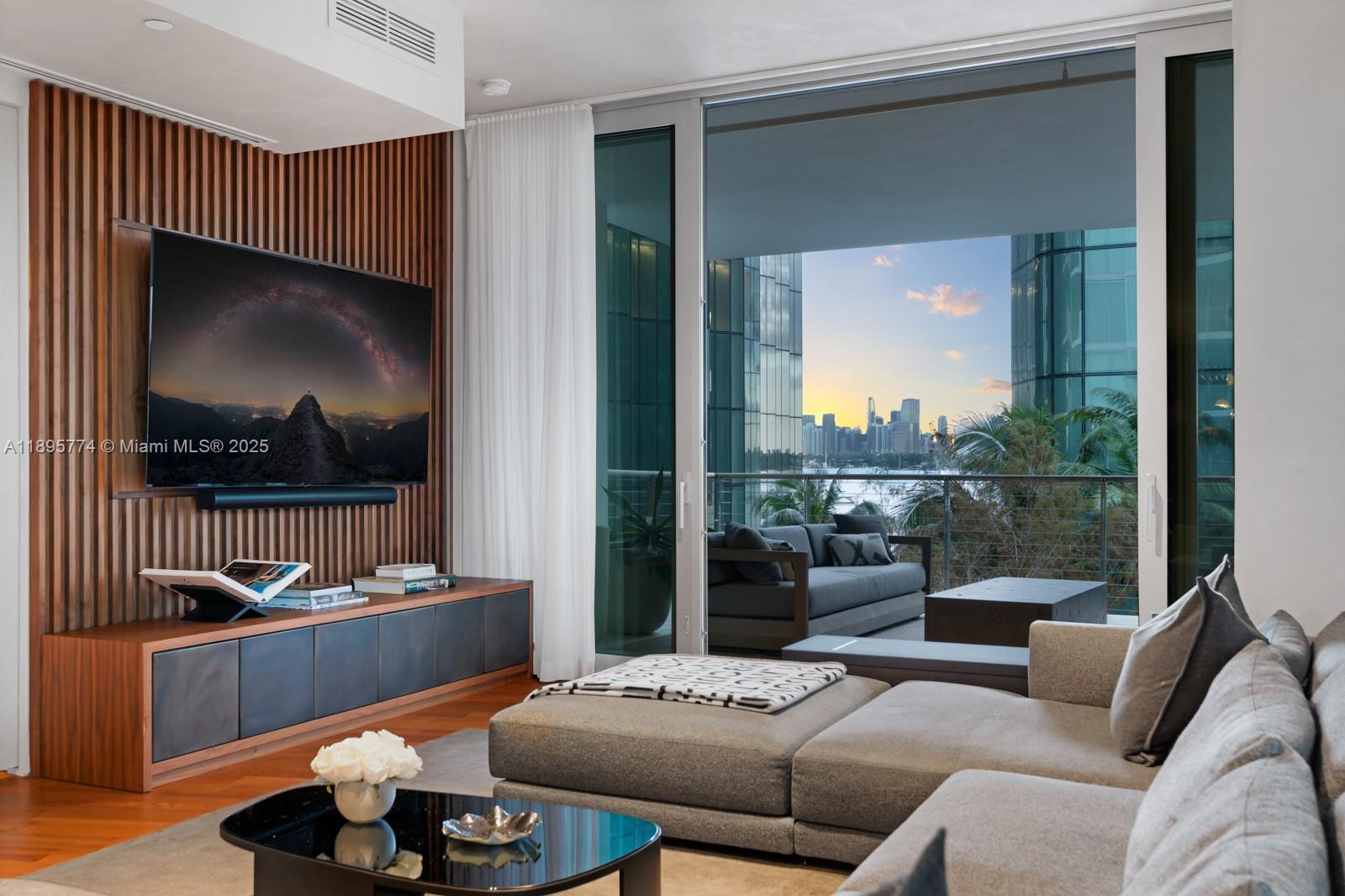 1300 Monad Terrace, Unit 3B Miami Beach, FL 33139 - Photo 1 of 35 a living room with furniture and a flat screen tv