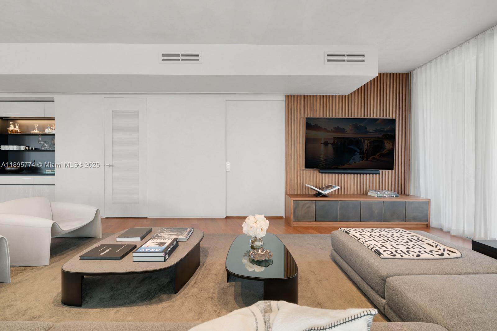 1300 Monad Terrace, Unit 3B Miami Beach, FL 33139 - Photo 13 of 35 a living room with furniture and a flat screen tv