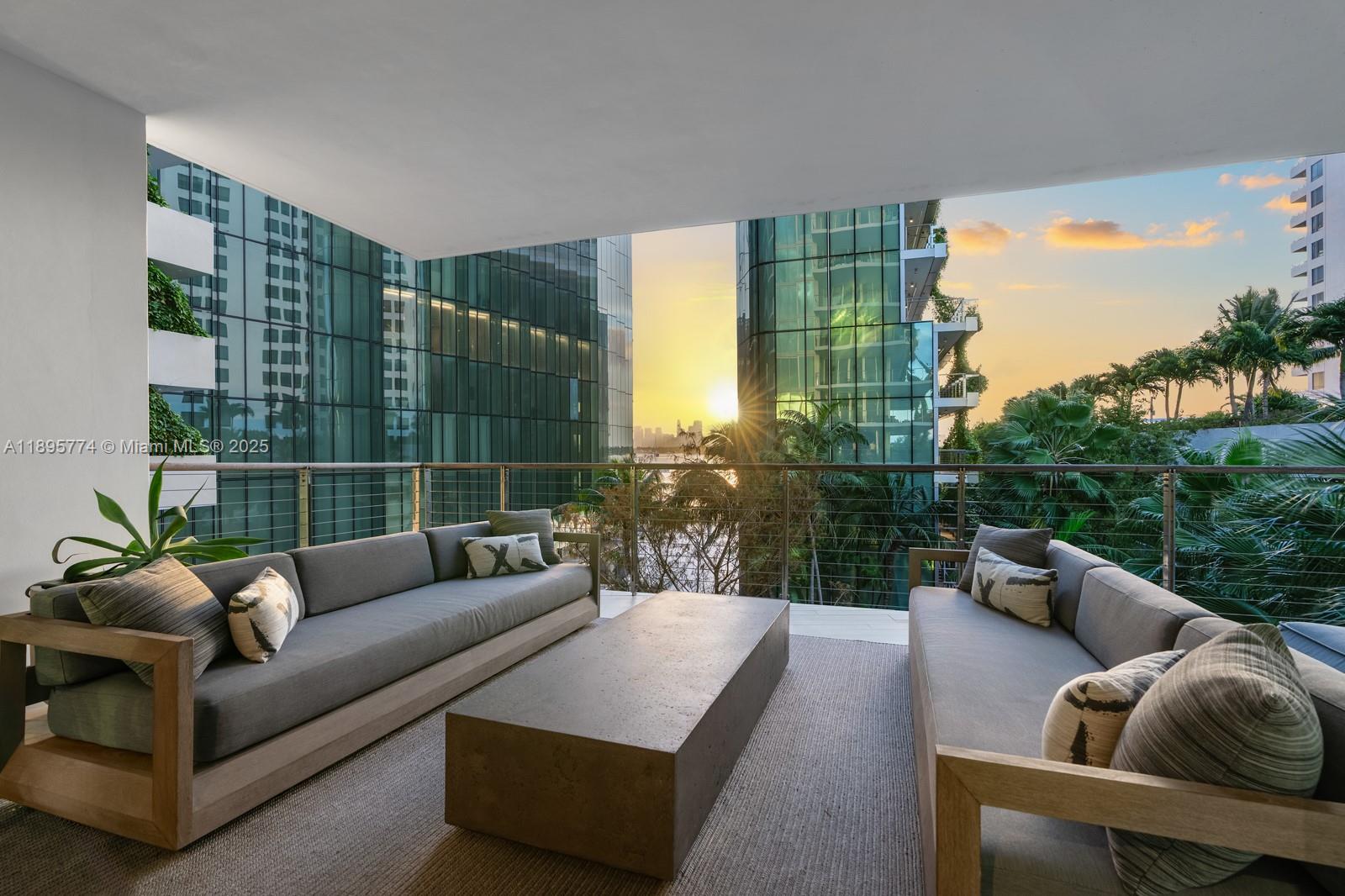 1300 Monad Terrace, Unit 3B Miami Beach, FL 33139 - Photo 2 of 35 a view of a patio with couches chairs and a potted plant