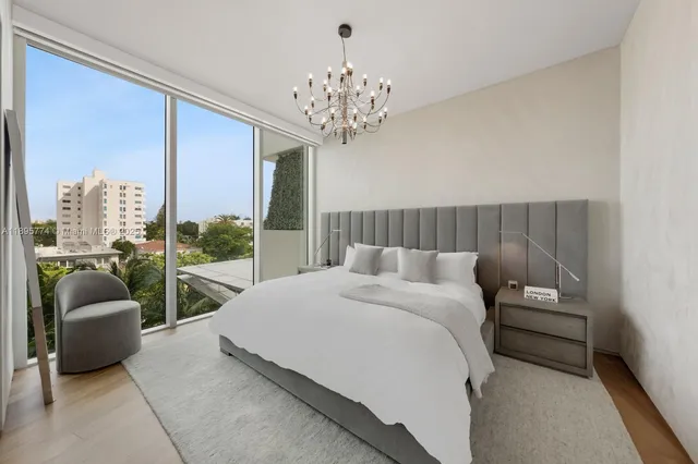 a white bath tub sitting next to a white shower