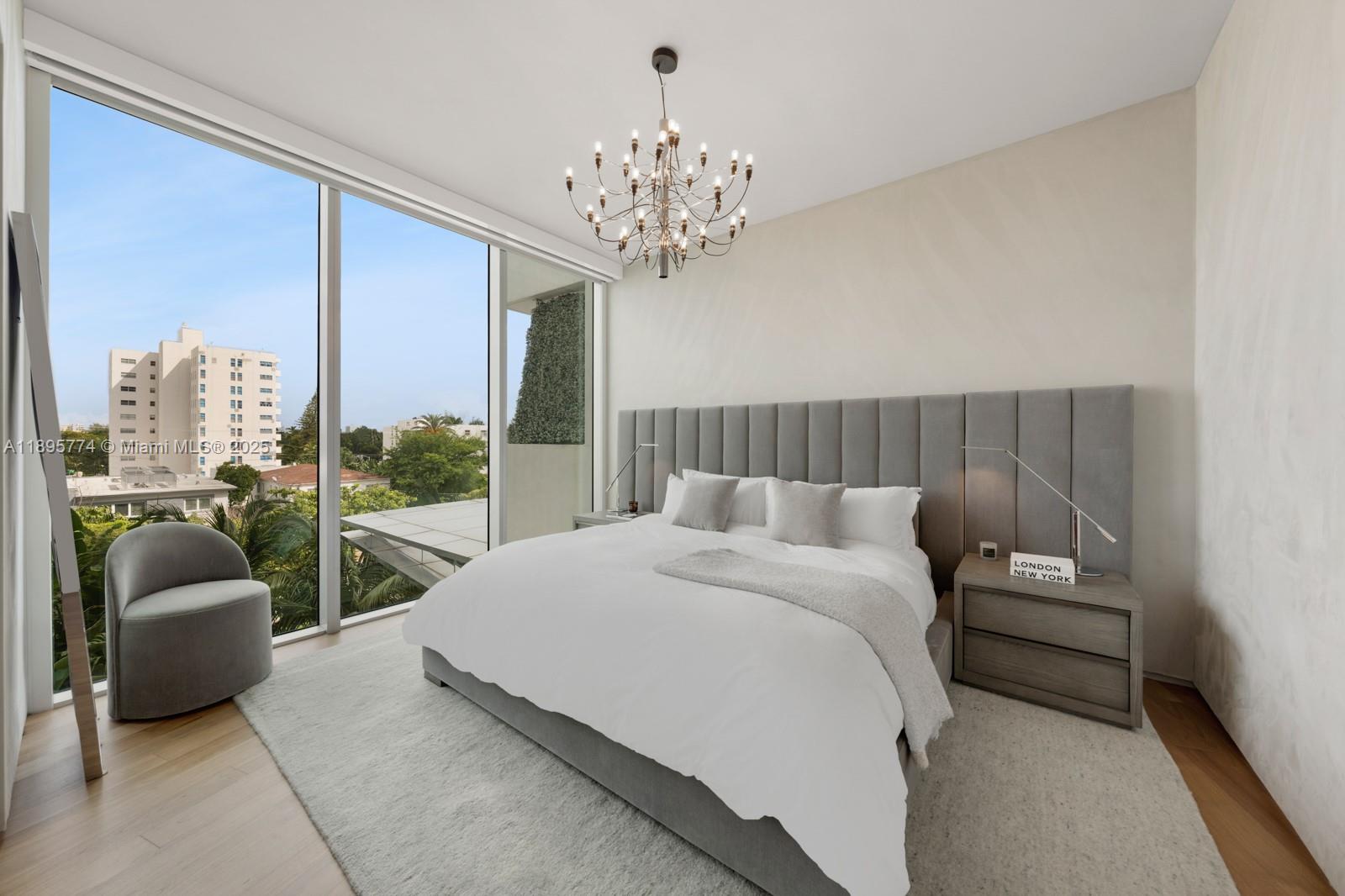 1300 Monad Terrace, Unit 3B Miami Beach, FL 33139 - Photo 22 of 35 a bedroom with a bed and a large window