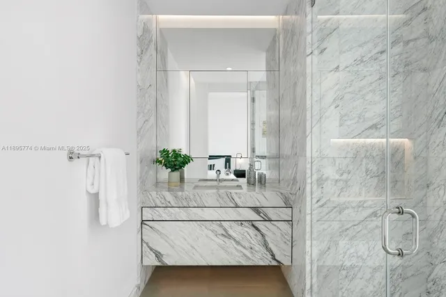 a bathroom with a sink double vanity and shower