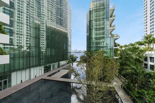 a view of a path along with potted plants