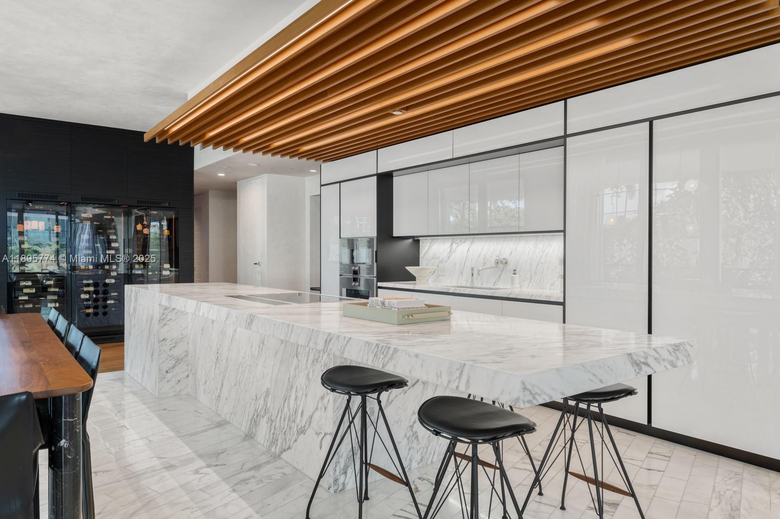 1300 Monad Terrace, Unit 3B Miami Beach, FL 33139 - Photo 7 of 35 a kitchen with a table and chairs