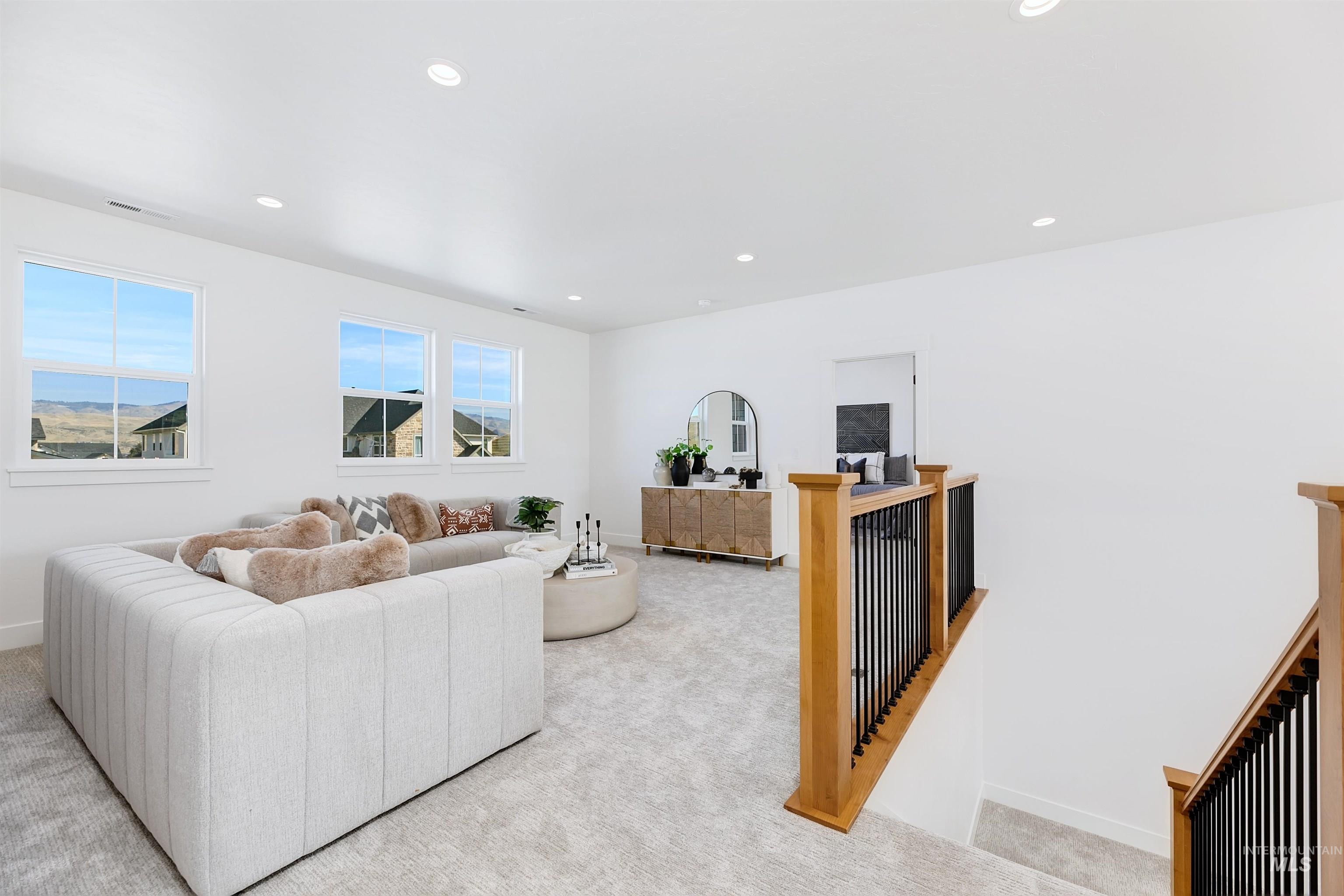 13623 North Ruffed Grouse Way Boise, ID 83714 - Photo 20 of 45 Living room featuring carpet flooring and recessed lighting