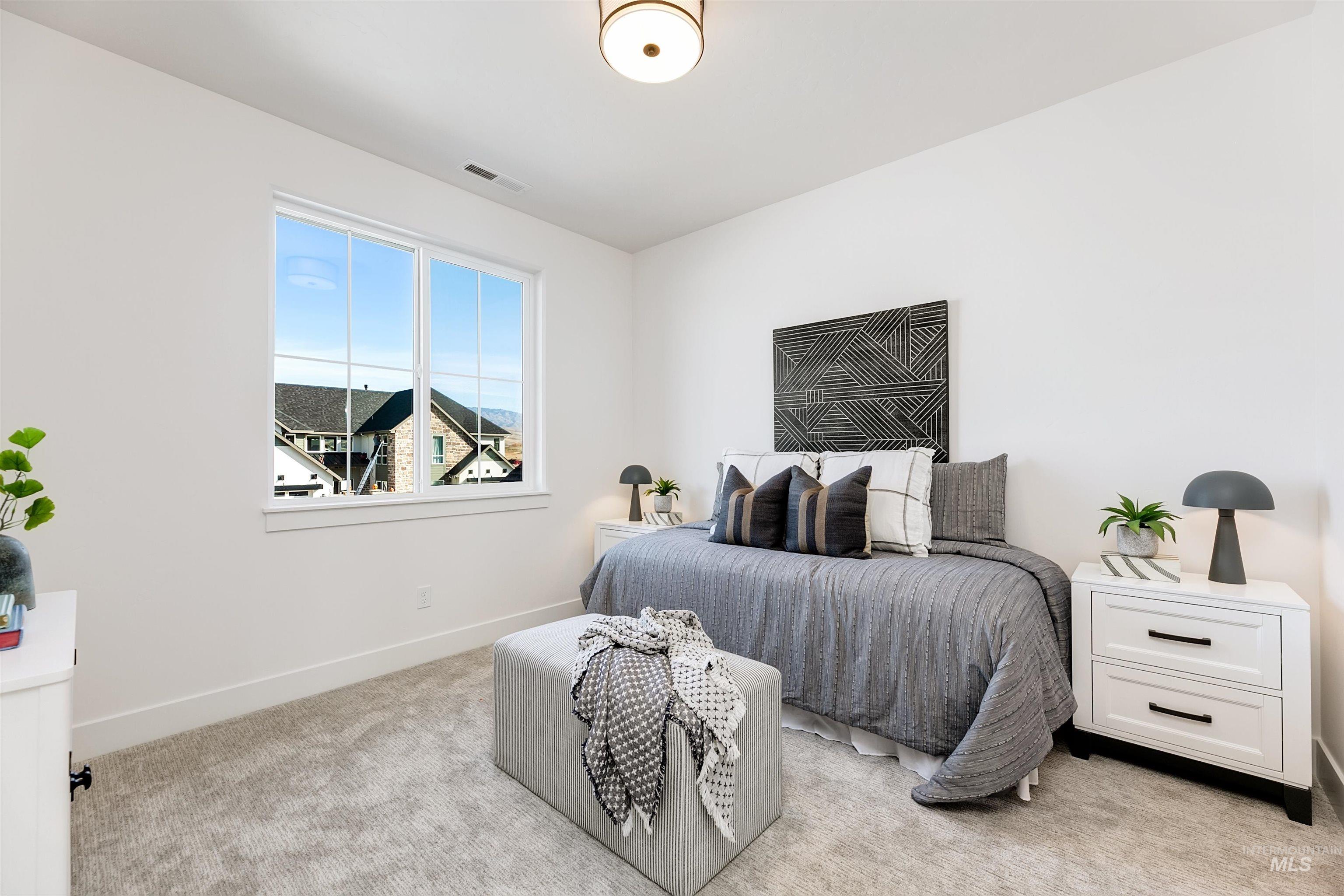 13623 North Ruffed Grouse Way Boise, ID 83714 - Photo 24 of 45 Bedroom with baseboards and light colored carpet
