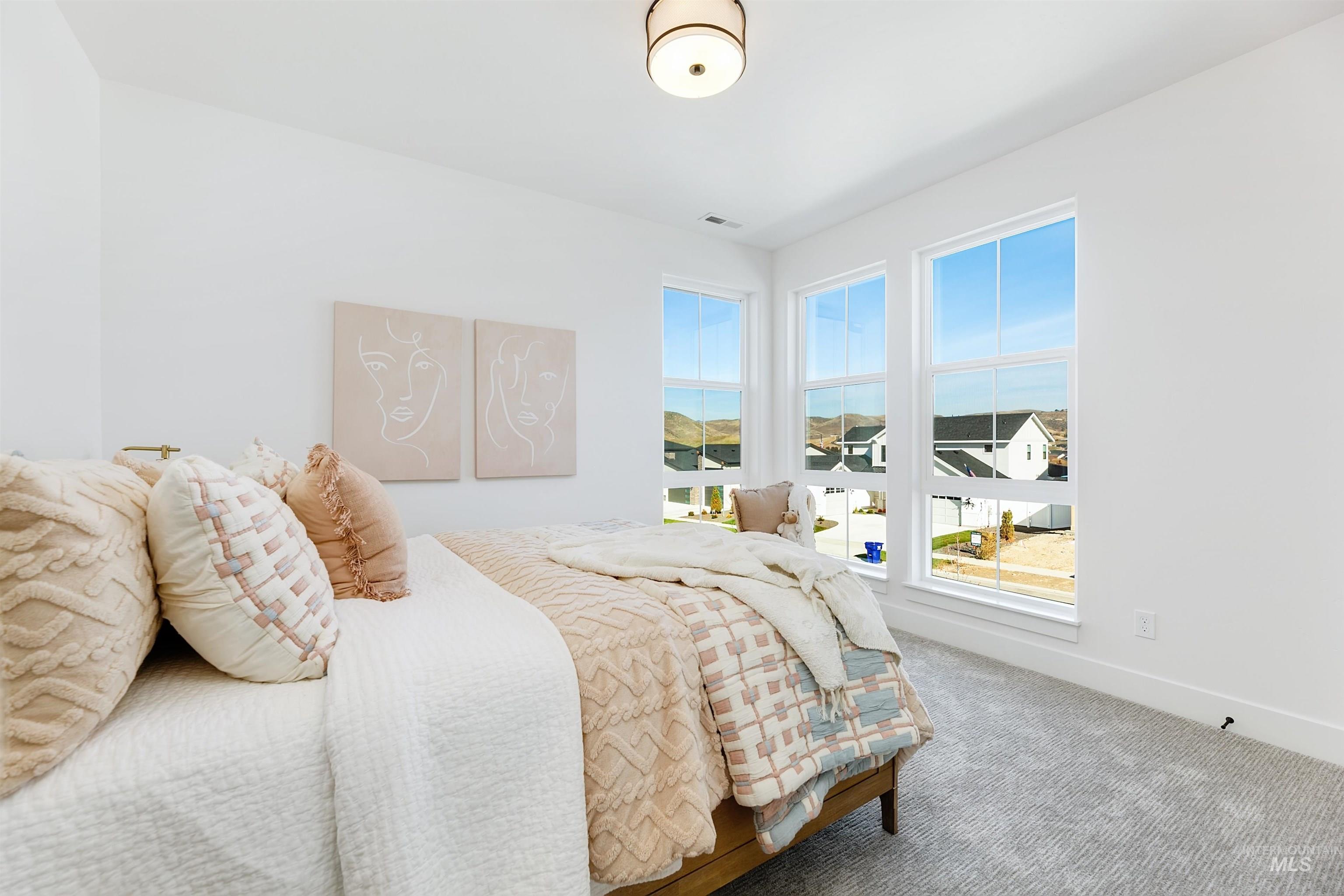13623 North Ruffed Grouse Way Boise, ID 83714 - Photo 26 of 45 Carpeted bedroom featuring baseboards