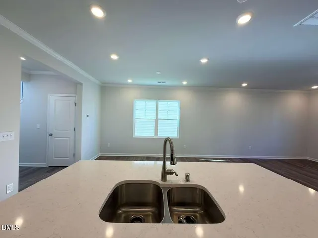 a bathroom with a sink and a window