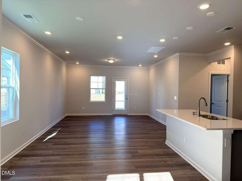 2008 English Saddle Lane Durham, NC 27703 - Photo 13 of 49 a view of an empty room with window and wooden floor