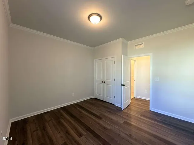 a view of room with wooden floor