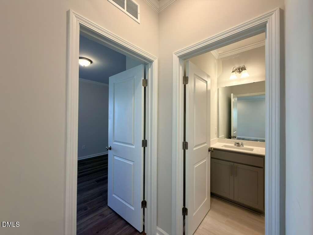 2008 English Saddle Lane Durham, NC 27703 - Photo 22 of 49 a bathroom with a sink and mirror with toilet