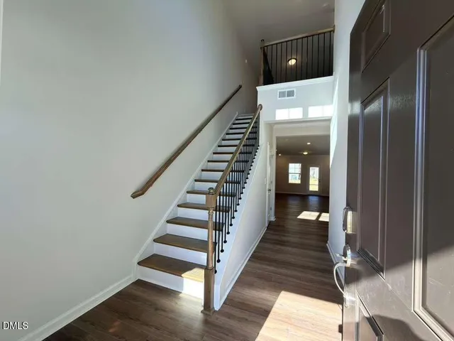 a view of entryway with wooden floor