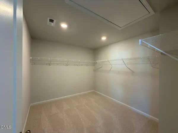 a view of a room with racks on the wall