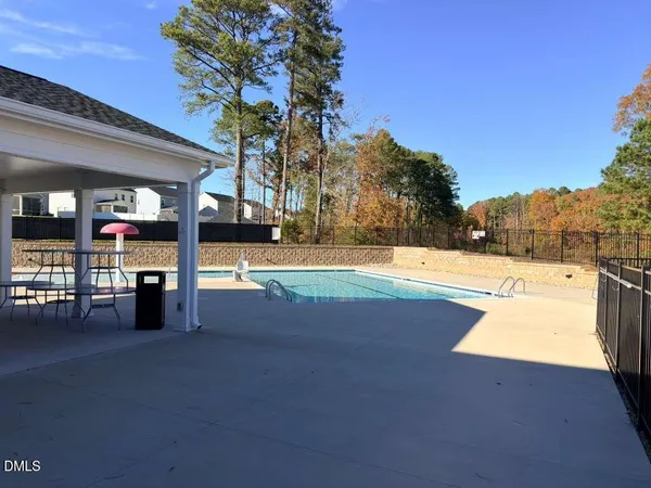 a view of a swimming pool with an outdoor seating