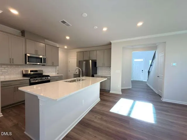 a large kitchen with cabinets