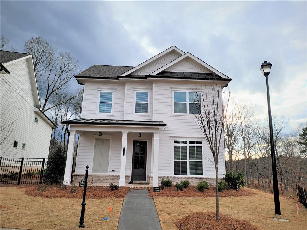 3565 Benedict Place Suwanee, GA 30024 - Photo 1 of 1 a front view of a house with a yard