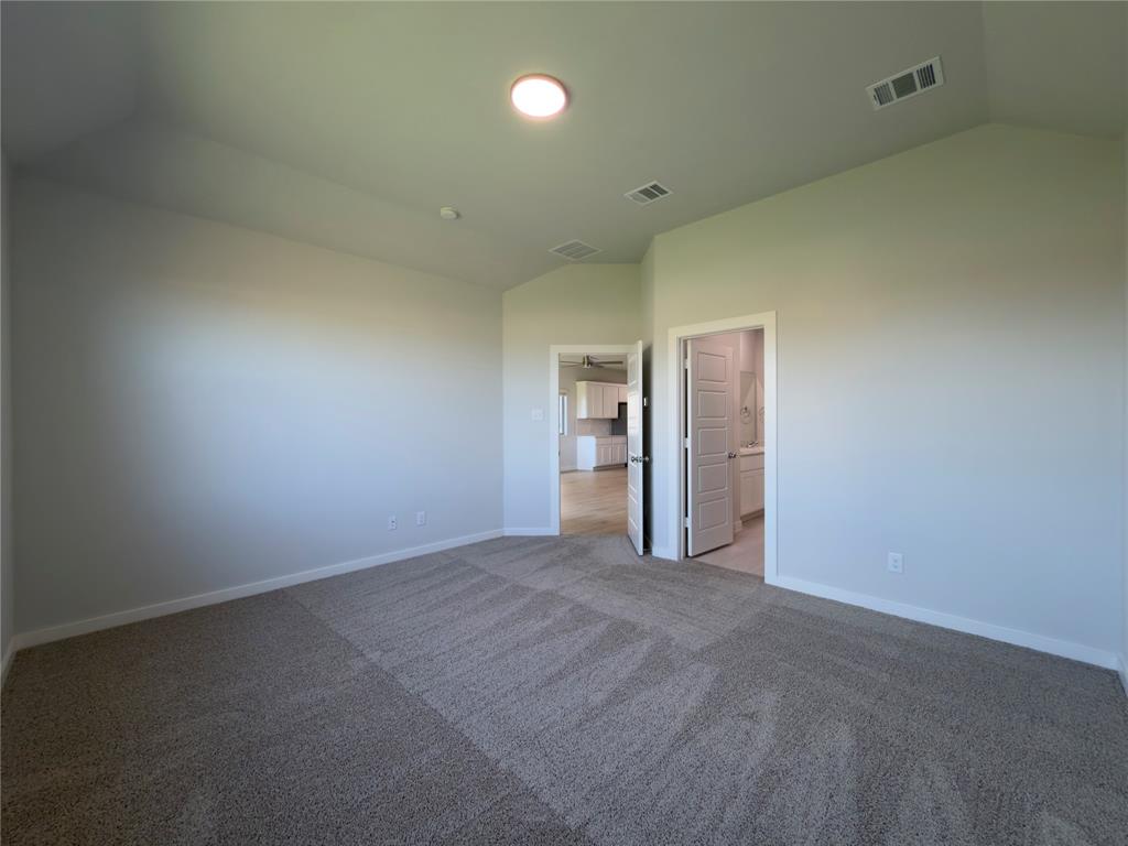 120 Millwood Road Lavon, TX 75166 - Photo 29 of 34 Carpeted interior room with vaulted ceilings and recessed lighting