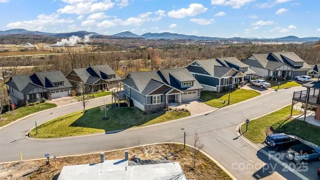 an aerial view of a house with outdoor space