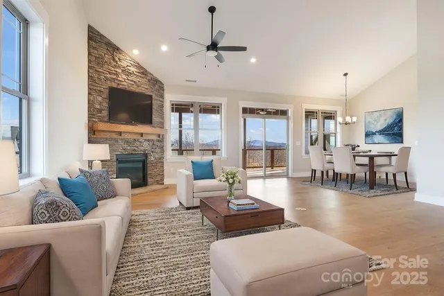 a living room with fireplace furniture and a flat screen tv