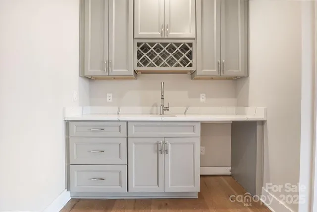 a bathroom with a sink vanity and mirror