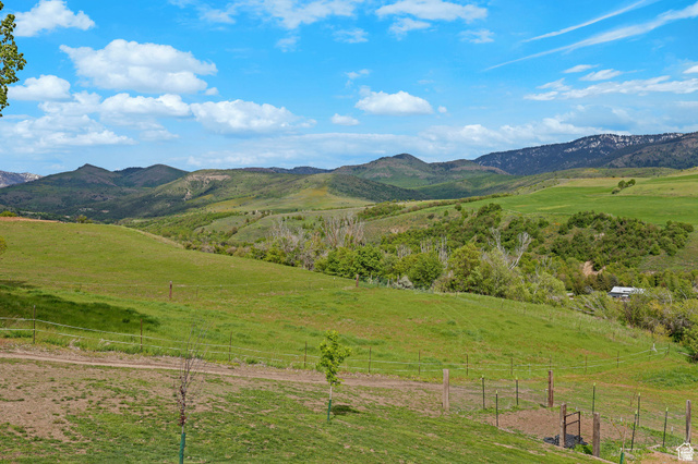 306 Spring Road Preston, ID 83263 - Photo 39 of 55 Expansive green pastures and rolling hills framed by distant mountains