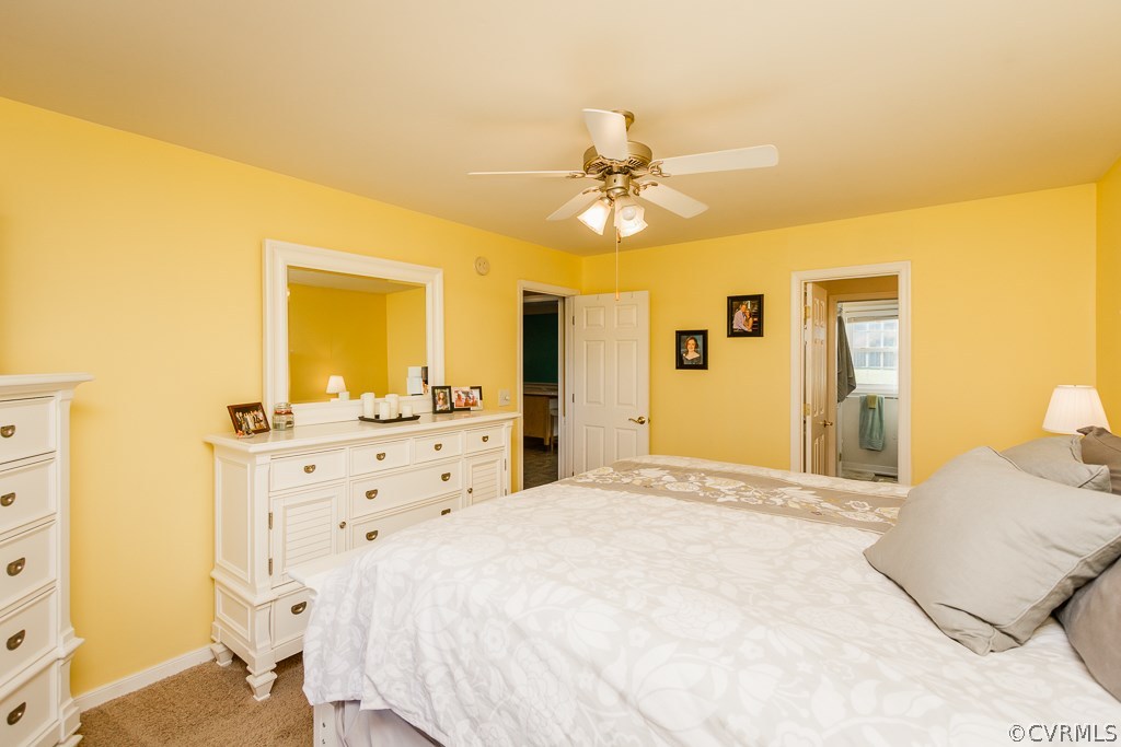 8398 Rowanty Road Carson, VA 23830 - Photo 14 of 34 a spacious bedroom with a bed and a dresser