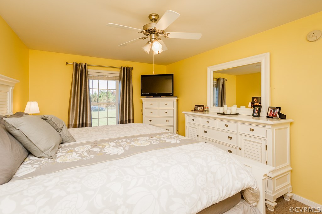 8398 Rowanty Road Carson, VA 23830 - Photo 15 of 34 a bedroom with a bed and a flat screen tv