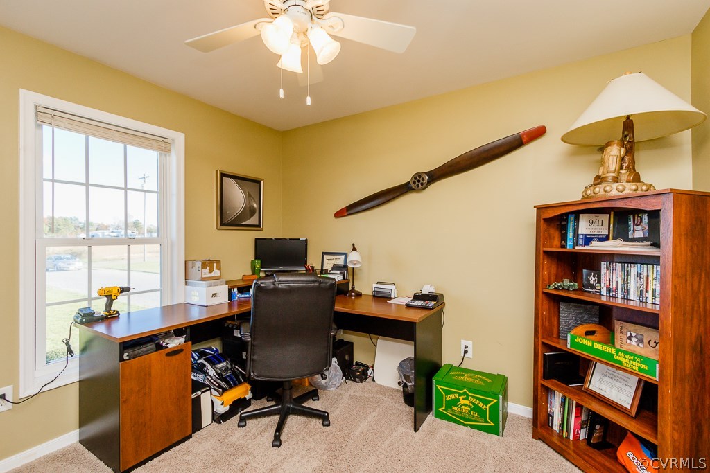 8398 Rowanty Road Carson, VA 23830 - Photo 19 of 34 a view of a workspace with furniture and a window