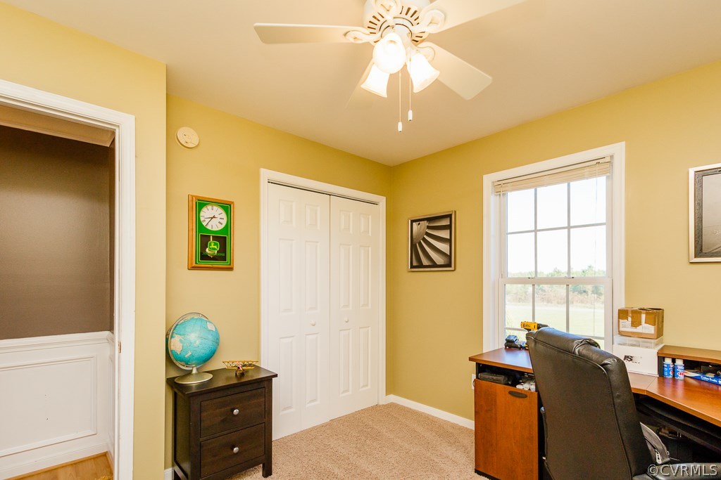 8398 Rowanty Road Carson, VA 23830 - Photo 20 of 34 a bedroom with a bed and a chandelier
