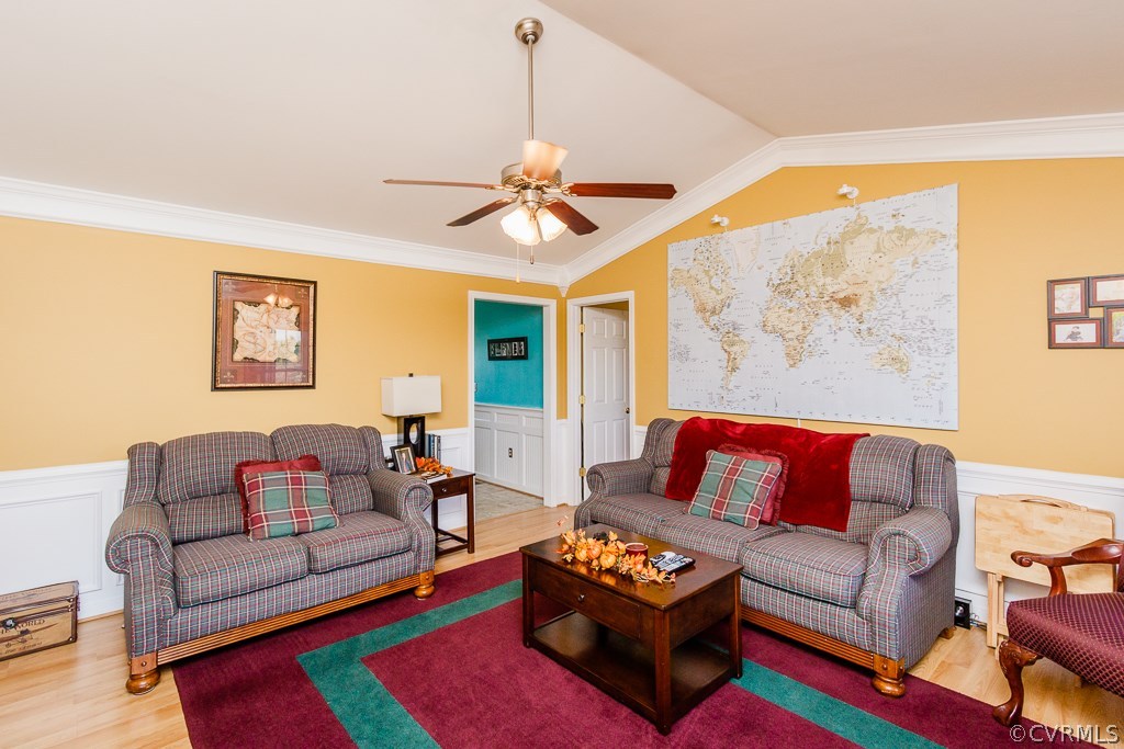 8398 Rowanty Road Carson, VA 23830 - Photo 2 of 34 a living room with furniture a rug and a chandelier