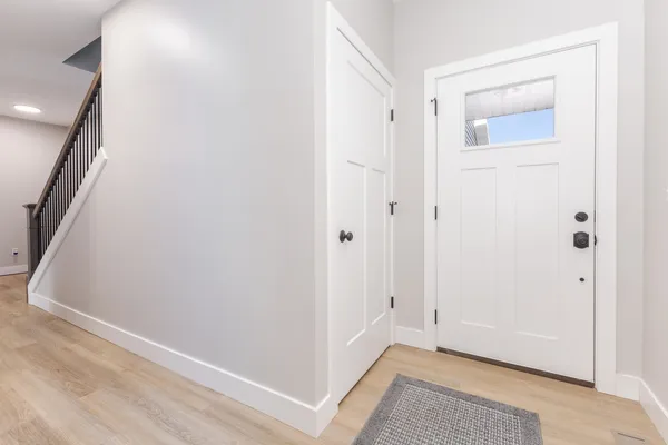 a view of a brick house with large windows