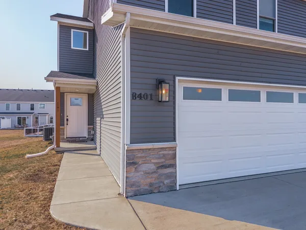 a kitchen with stainless steel appliances a stove a sink and a refrigerator