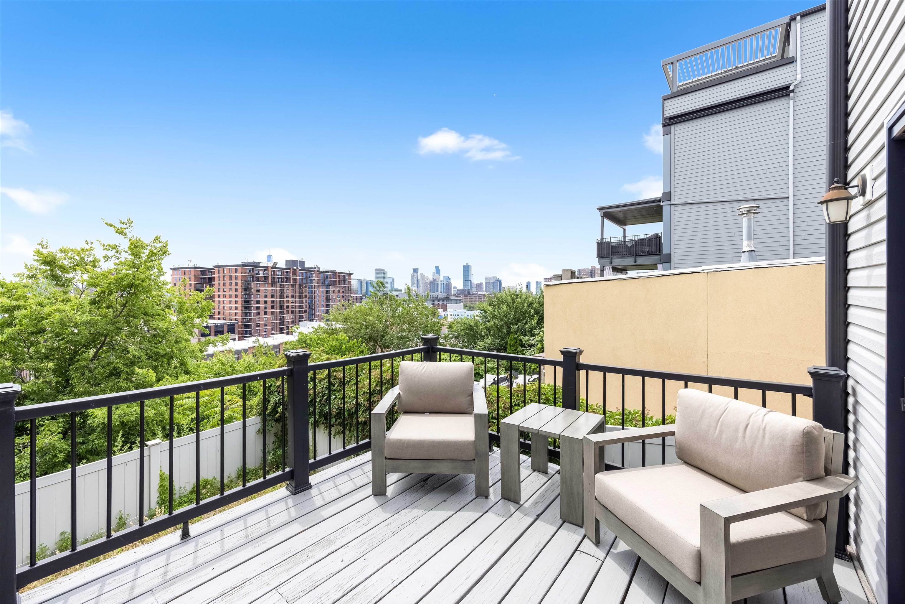 107 Mountain Road Jersey City, NJ 07307 - Photo 15 of 41 a balcony with wooden benches