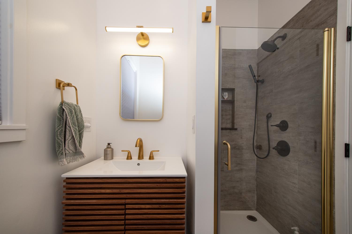 207 North Montgomery Street Ojai, CA 93023 - Photo 10 of 11 a bathroom with a sink a mirror and shower