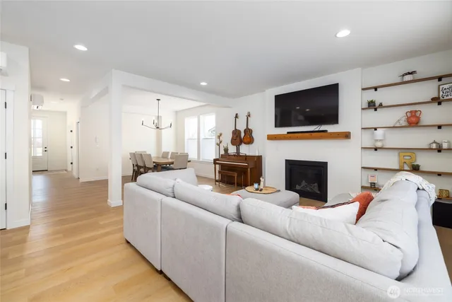a living room with furniture and kitchen view