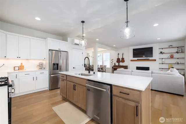 a utility room with sink dryer and washer