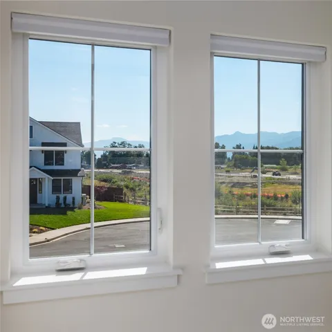 a spacious bedroom with a bed and a couch
