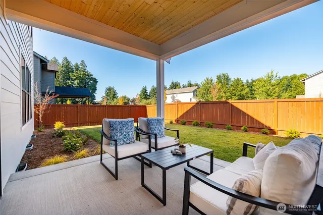 a living room with furniture and a area