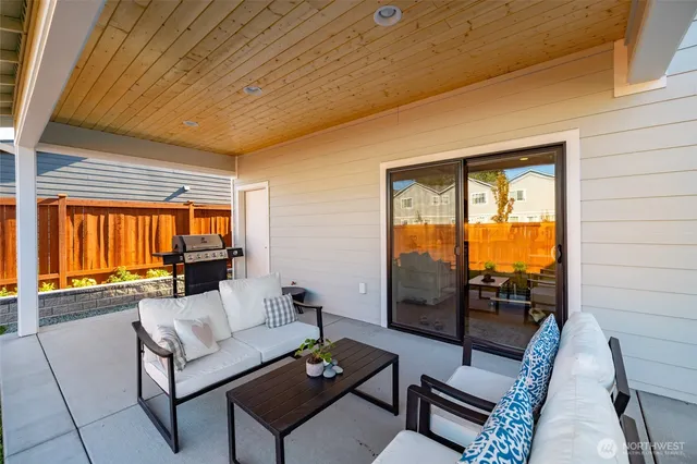 a view of a house with swimming pool and porch