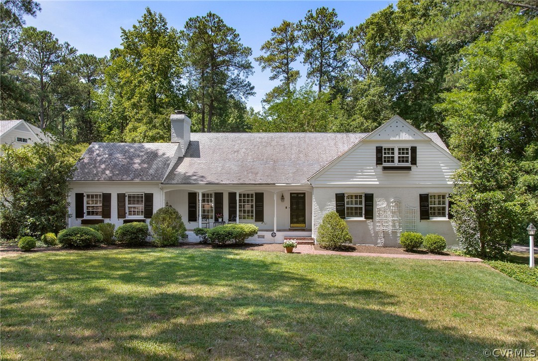 a front view of house with yard and green space