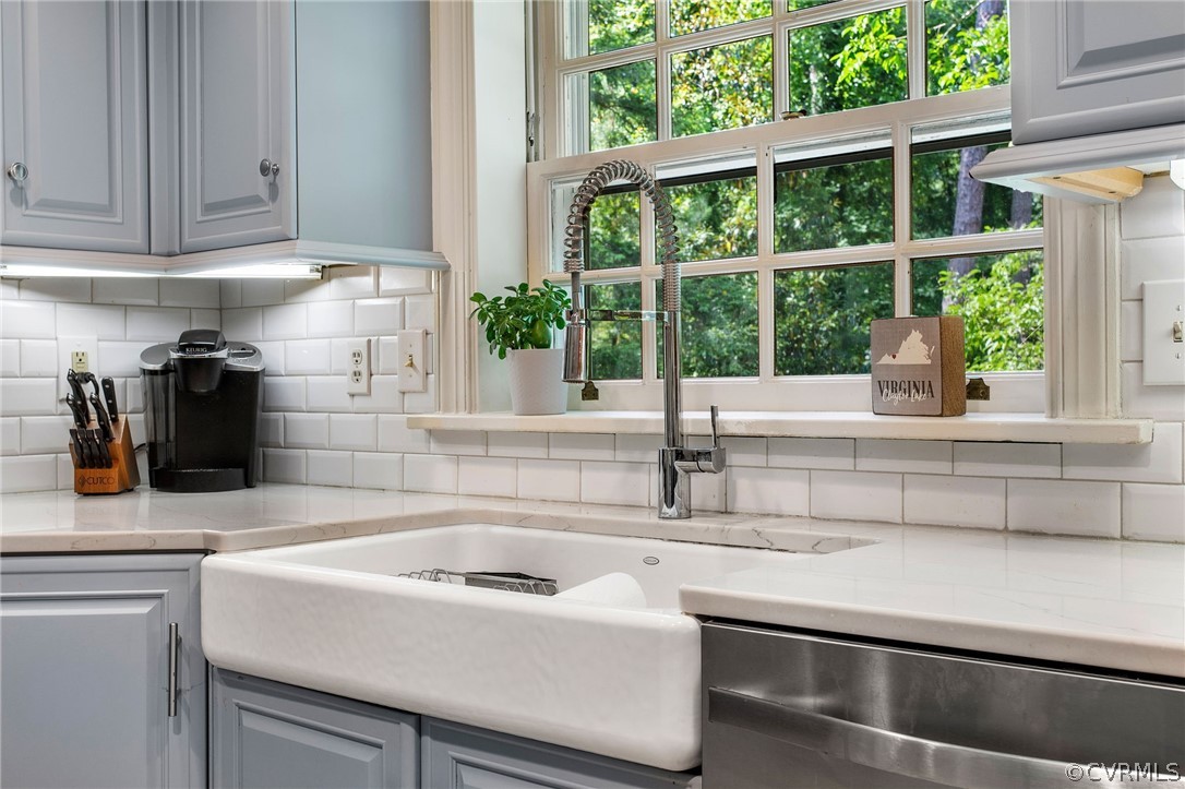 8015 Thom Road Henrico, VA 23229 - Photo 13 of 50 a kitchen with a sink and large window