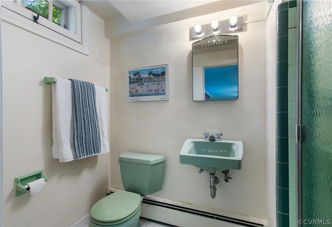 8015 Thom Road Henrico, VA 23229 - Photo 36 of 50 a bathroom with a toilet sink and mirror