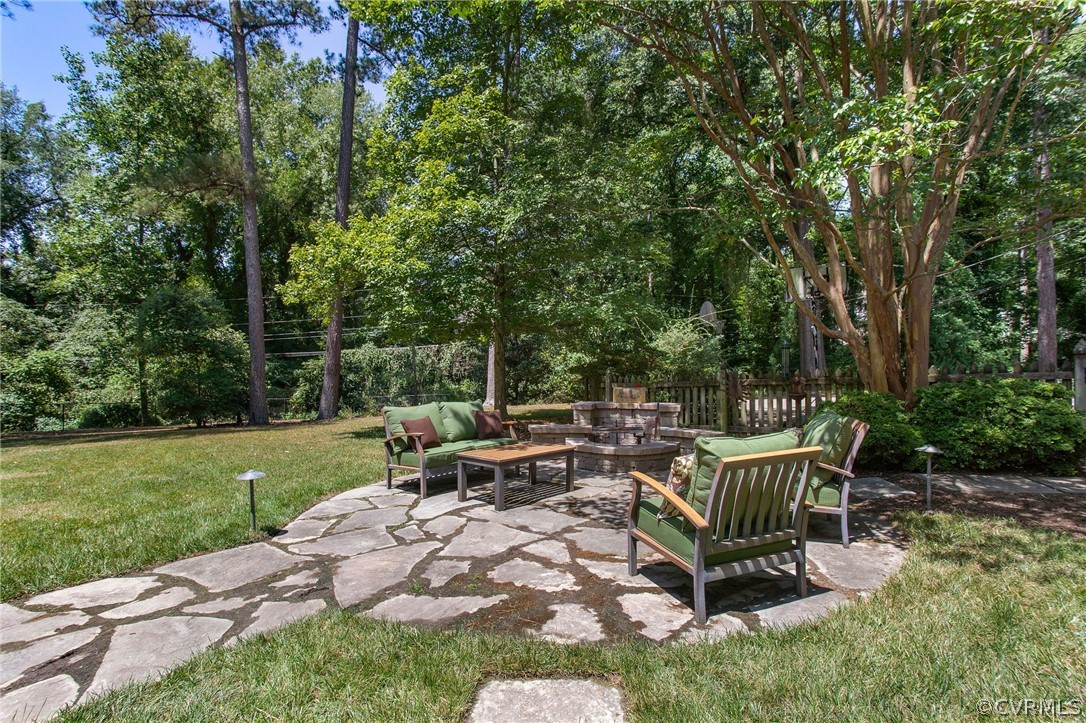 8015 Thom Road Henrico, VA 23229 - Photo 39 of 50 a view of a bench in the garden