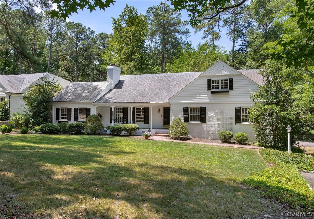 8015 Thom Road Henrico, VA 23229 - Photo 50 of 50 a front view of a house with a garden and trees