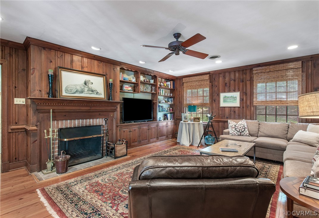 8015 Thom Road Henrico, VA 23229 - Photo 8 of 50 a living room with furniture a flat screen tv and a fireplace