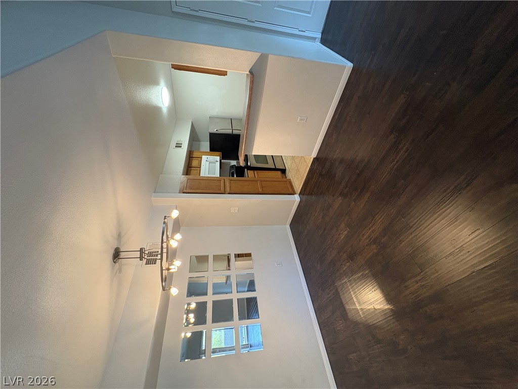 7255 West Sunset Road, Unit 2023 Las Vegas, NV 89113 - Photo 2 of 24 Rich wood-look flooring flows throughout this versatile dining area leading into the kitchen.